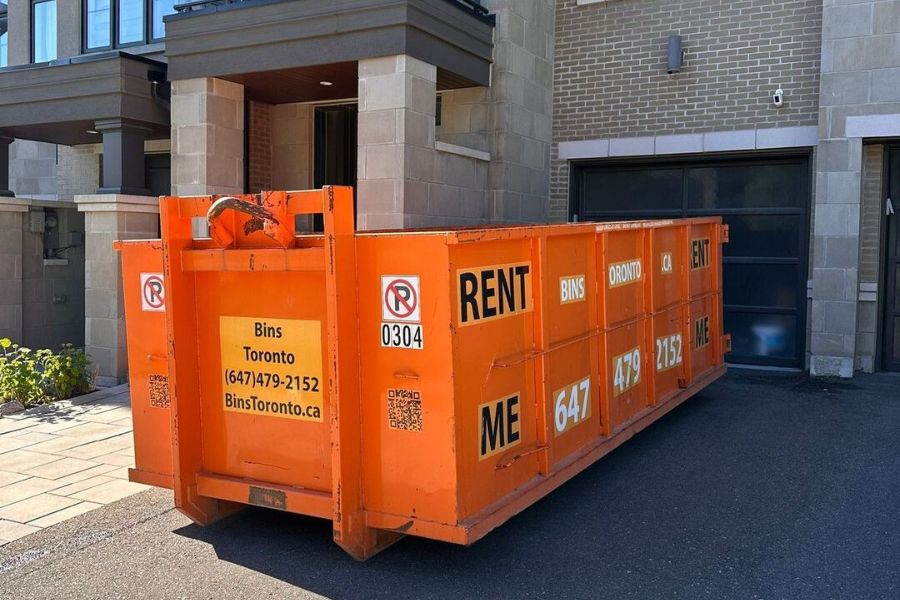 dumpster bin rental placed on driveway