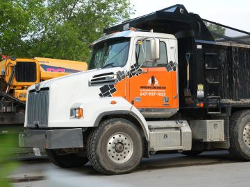 Bins Toronto branded dump truck for concrete and asphalt disposal in the GTA