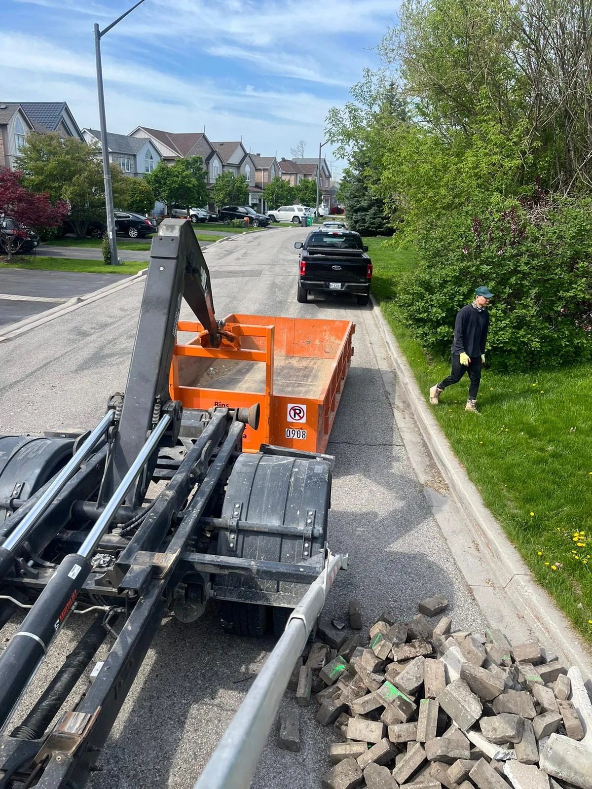 Proper dumpster placement in a residential driveway in Etobicoke